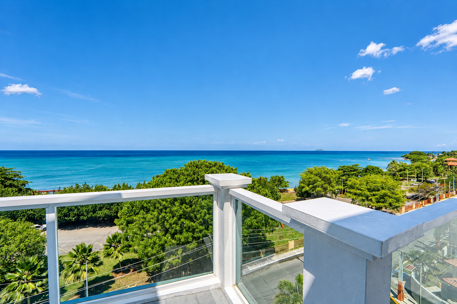 Caribbean ocean view from the penthouse balcony across from Balneario Rincón